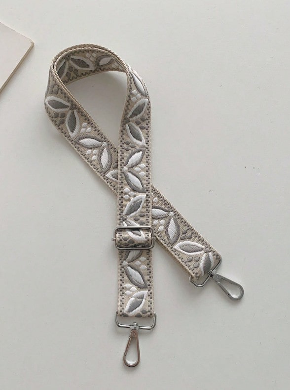 Béžový popruh na kabelku/ledvinu s listovým vzorem